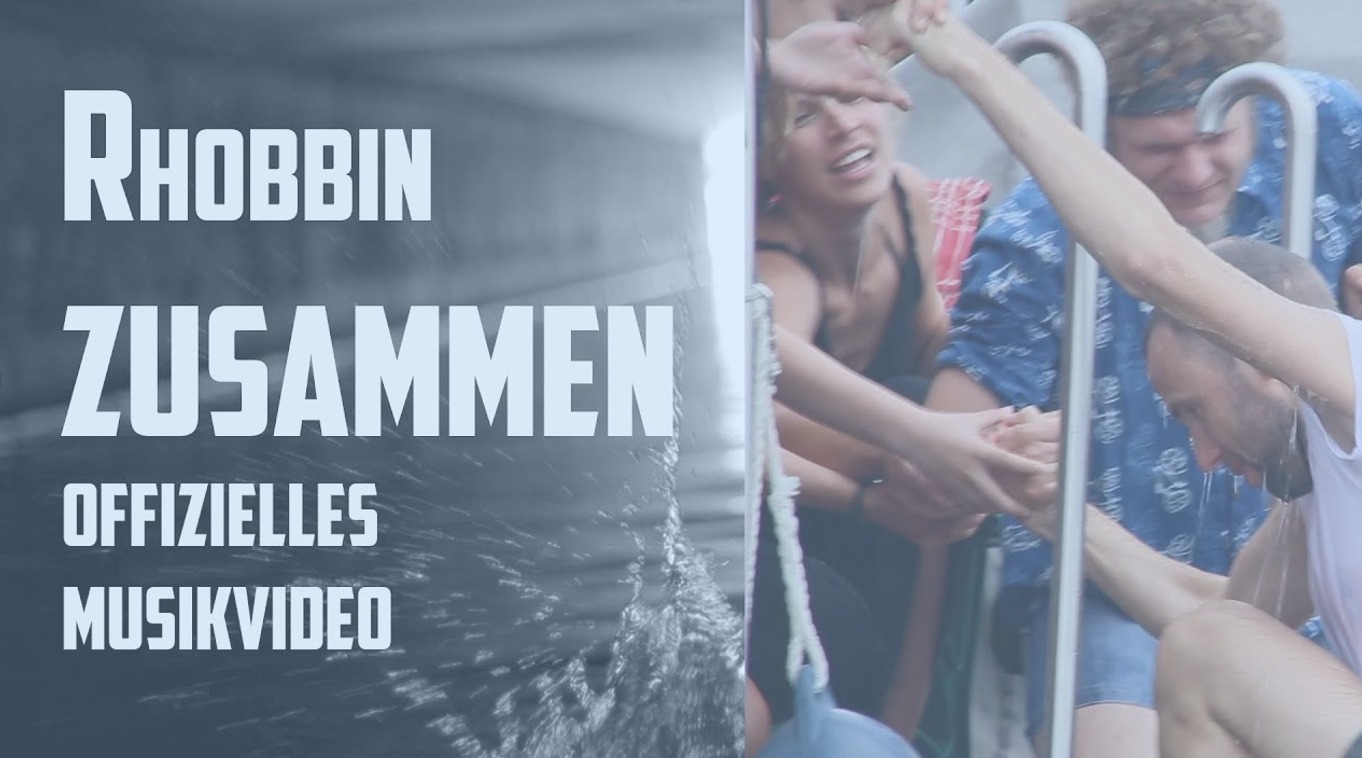 Mehrere Menschen mit Text Rhobbin "Zusammen" - offizielles Musikvideo
